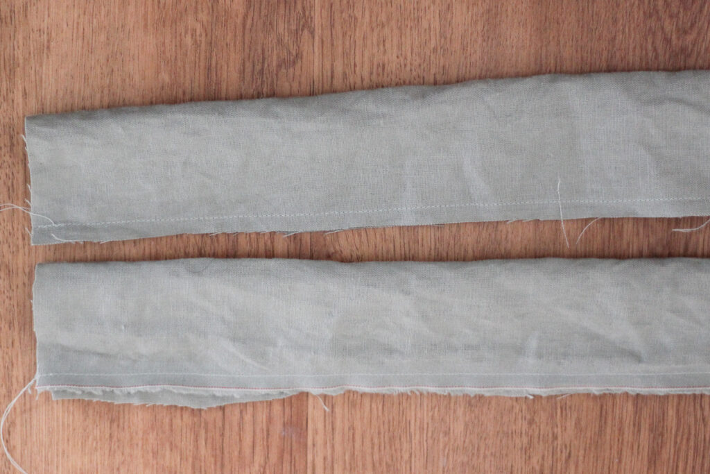 long pieces of fabric sewn with a hem on raw side