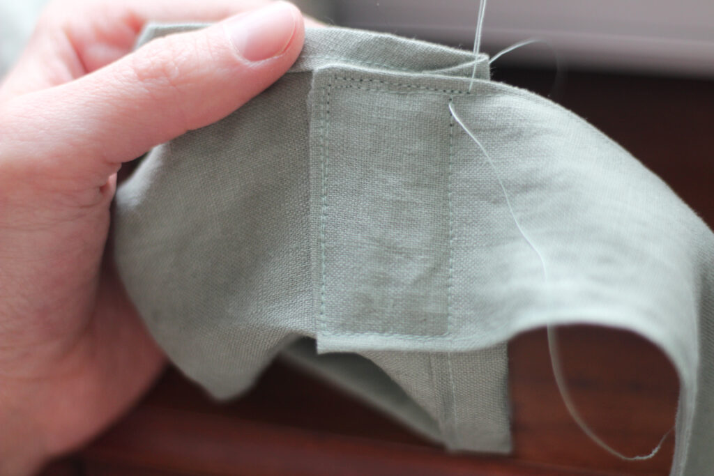 close up of women stitching fabric