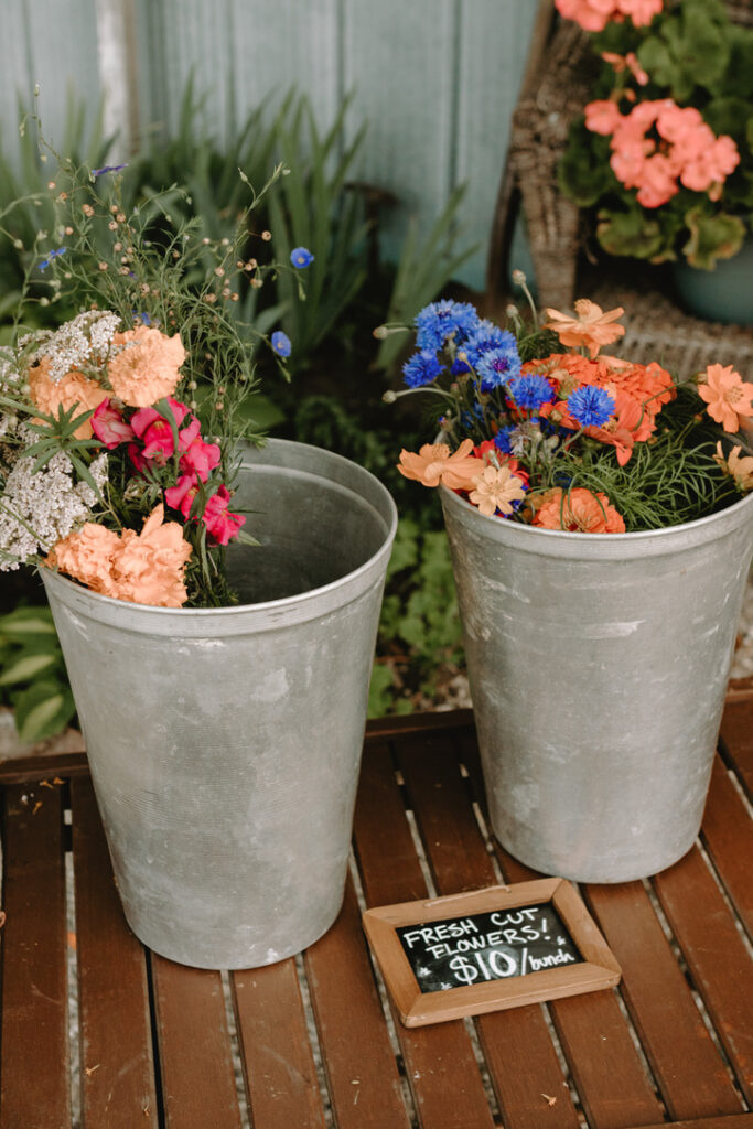 Flowers in tin buckets