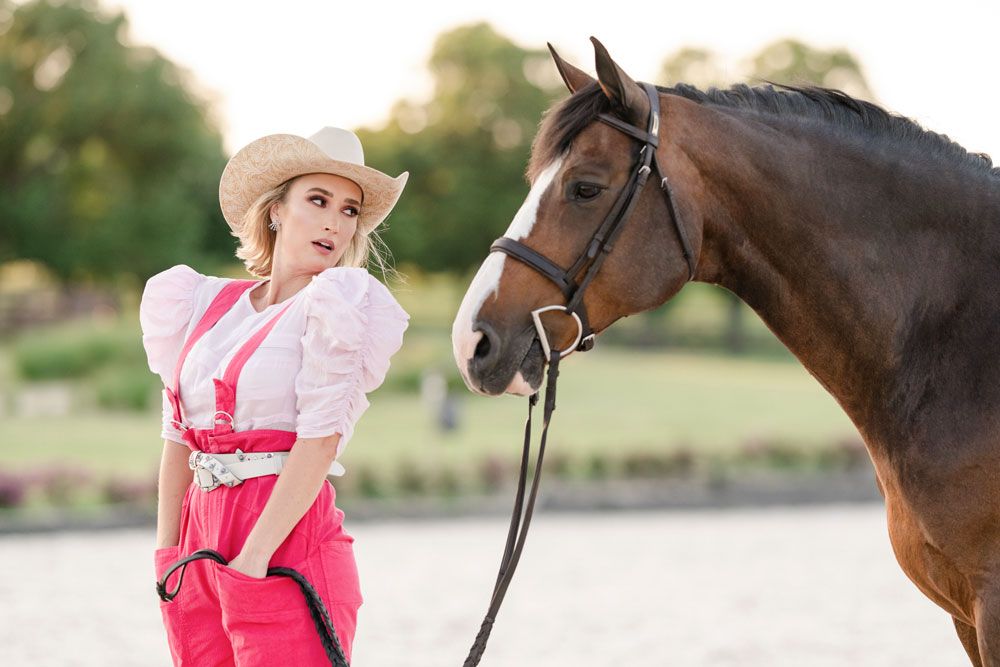 Courteney DeHoff stands with her brown horse